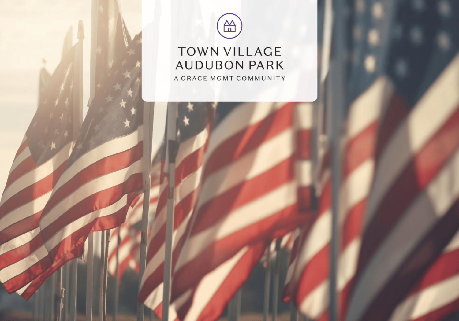 Row of American flags in soft focus with a translucent panel bearing the Town Village Audubon Park logo in the center.