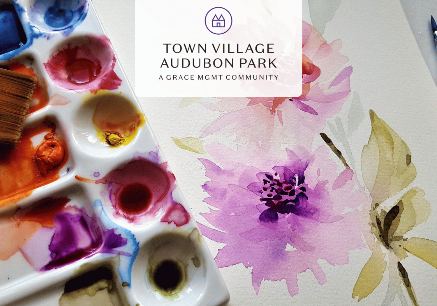 Art supplies and a pink watercolor flower artwork with a white banner showing the Town Village Audubon Park logo overlayed on top of the image.